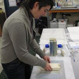AHT Conservator Lizzie Meek repackaging candles