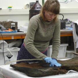 AHT Conservator Carla Pike treating artefact