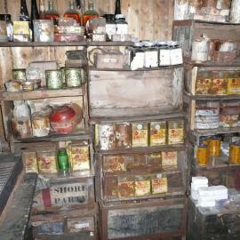 Venesta case shelving stocked with artefacts in galley, Scott's 'Terra Nova' Hut