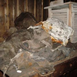 Furs, textiles, boots and Stevenson screen in Messdeck, Scott's 'Terra Nova' Hut