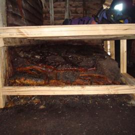 Temporary protection frame built for blubber stack, Scott's 'Terra Nova' Hut