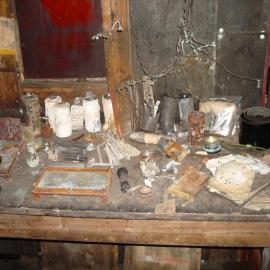 Artefacts on 'Make and Mend' bench, Scott's 'Terra Nova' Hut (001)