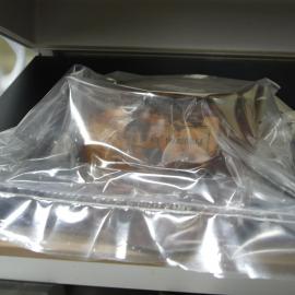 Corroded tin being vacuum sealed (003)