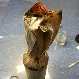 Unfolding wrapper on bottle (001)