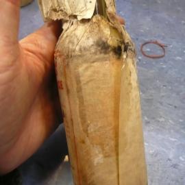 Unfolding wrapper on bottle (002)