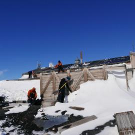 2017-18 Scott's 'Terra Nova' hut, conservators at work, AHT staff removing snow