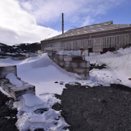 2017-18 Shackleton's 'Nimrod' hut, exterior, snow build-up in Garage and Stables