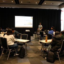 2023 Owain John with students at the Explorer Conference