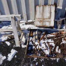 2018-19 Artefacts outside the West wall of Scott's 'Terra Nova' hut, Cape Evans