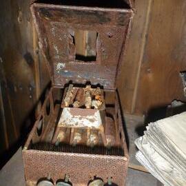 Portable fuel camp stove and magazines in Scott's 'Terra Nova' hut (001)