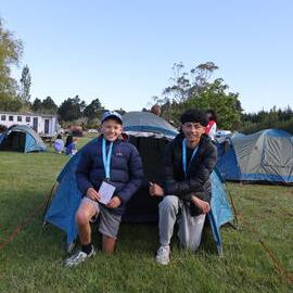 Young Inspiring Explorers with their pitched tent