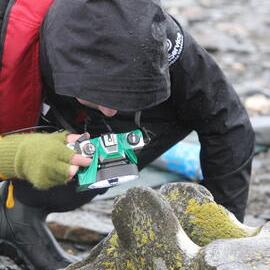 Inspiring Explorer Peregrin Hyde photographing whale bones
