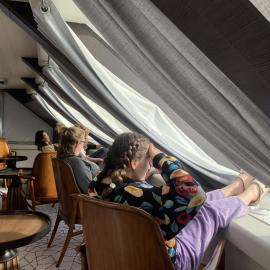 Inspiring Explorers look out the windows of the 'Magellan Explorer'