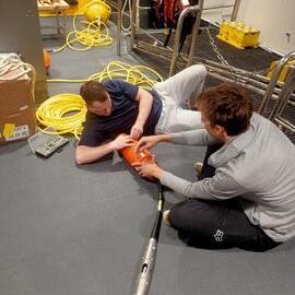 Lawrence Rothwell and Henry Conquer with MetService spotter buoy