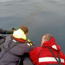 Inspiring Explorer Lawrence Rothwell and MetService's Peter Fisher taking Mangōpare Temperature Sensor measurements