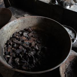 Seal meat in pan, blubber stove in Scott's 'Discovery' hut