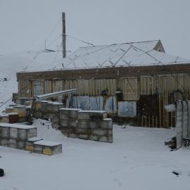 Shackleton's 'Nimrod' hut during snowfall
