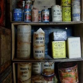 Tinned food artefacts on shelf in Scott's 'Terra Nova' hut
