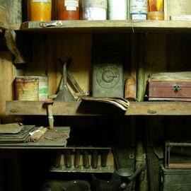 Chemical bottles, beakers and equipment on shelves in the Darkroom