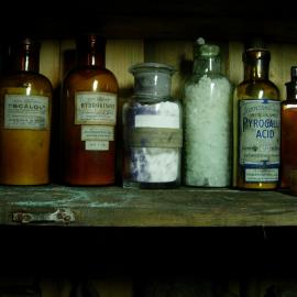 Chemical bottles on shelves in the Darkroom