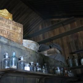 2014-15 Scott's 'Terra Nova' hut, interior, artefacts atop Darkroom