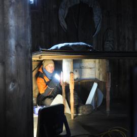 2013-14 Nicola Dunn working inside Scott's 'Terra Nova' hut, Cape Evans