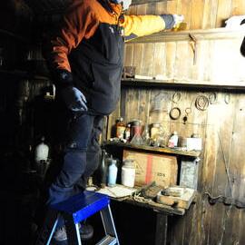 2013-14 Josiah Wagener working inside Scott's 'Terra Nova' hut, Cape Evans