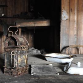 2013-14 Artefacts on the Wardroom table inside Scott's 'Terra Nova' hut
