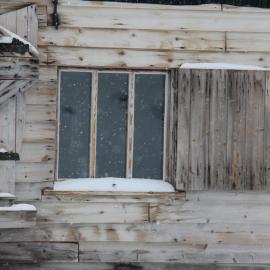 2022 Scott's 'Terra Nova' hut, exterior detail, South elevation window during snowfall