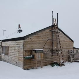 2022 Scott's 'Terra Nova' hut, exterior, viewed from South-east during snowfall (001)