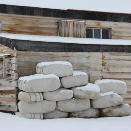 2022 Scott's 'Terra Nova' hut, exterior detail, fodder bales during snowfall