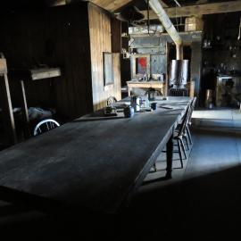2022 Scott's 'Terra Nova' hut, interior, Wardroom table, looking East